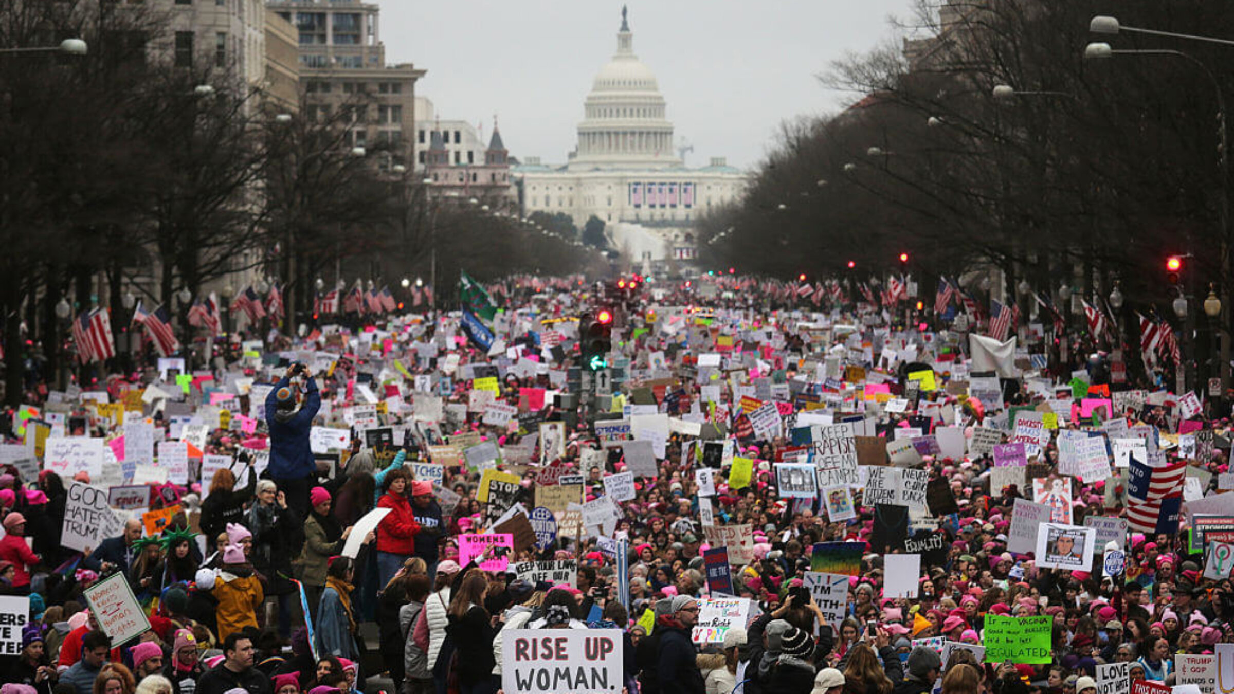 Protesters walk during the Women's March on Washington, with the U.S. Capitol in the background, on January 21, 2017 in Washington, DC.