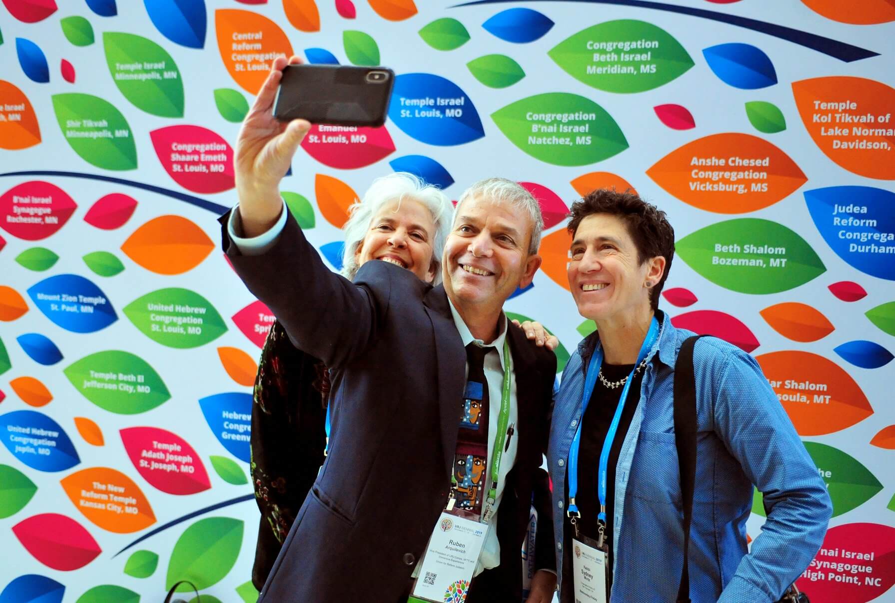 Participants at the Union for Reform Judaism's 2019 convention in Chicago pose in front of a photo backdrop. The congregational arm of the Reform movement unveiled a new logo and visual brand earlier this month.