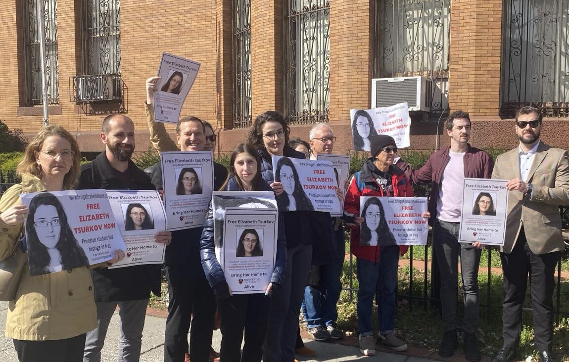 Supporters of Elizabeth Tsurkov, an academic kidnapped in Iraq a year ago, held a rally at the Iraqi Embassy in Washington, Mar. 21, 2024.  Her sister Emma is standing center, with glasses.