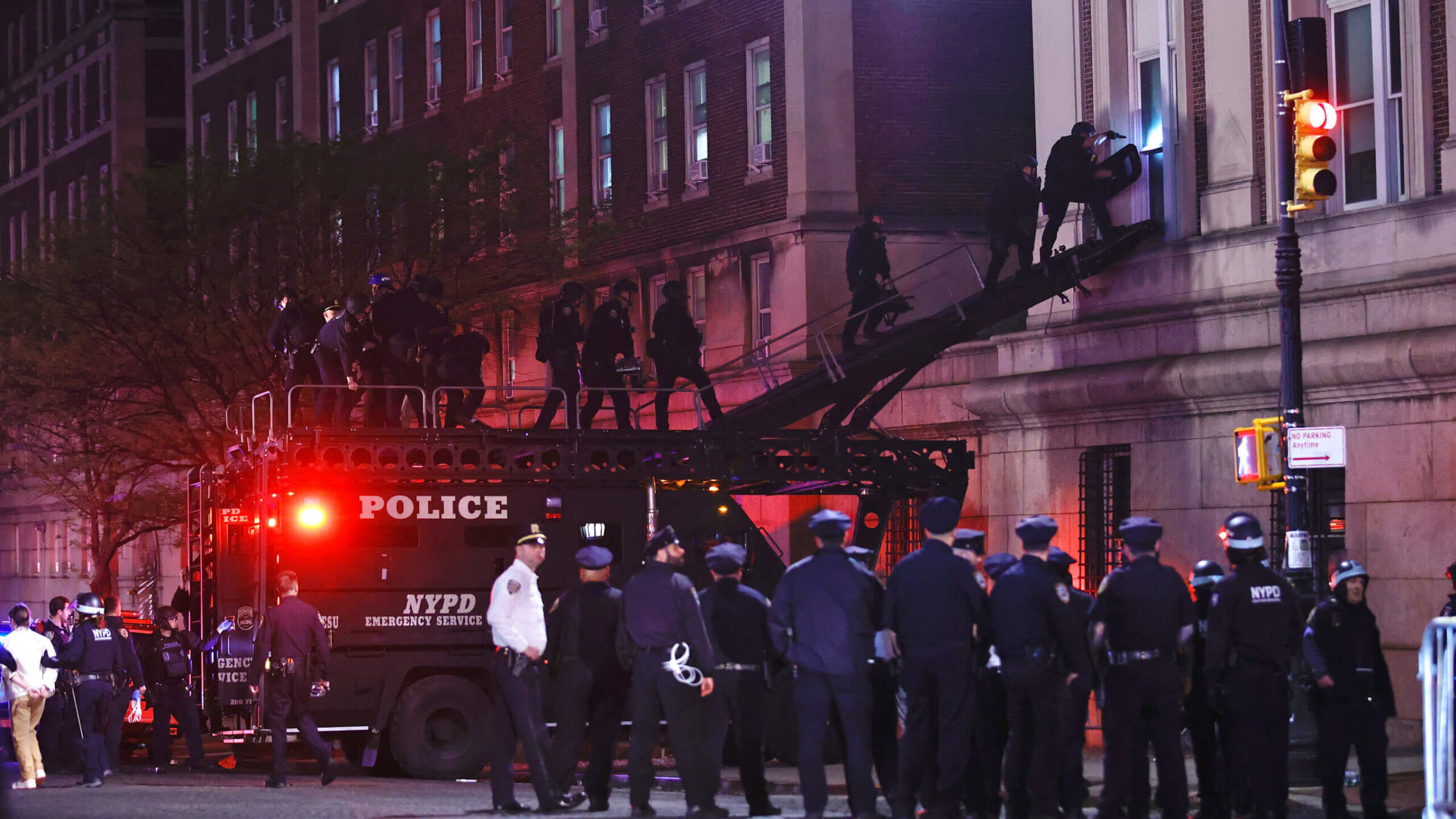 NYPD officers in riot gear break into Hamilton Hall at Columbia University, where pro-Palestinian students  barricaded themselves inside a building, April 30, 2024. 