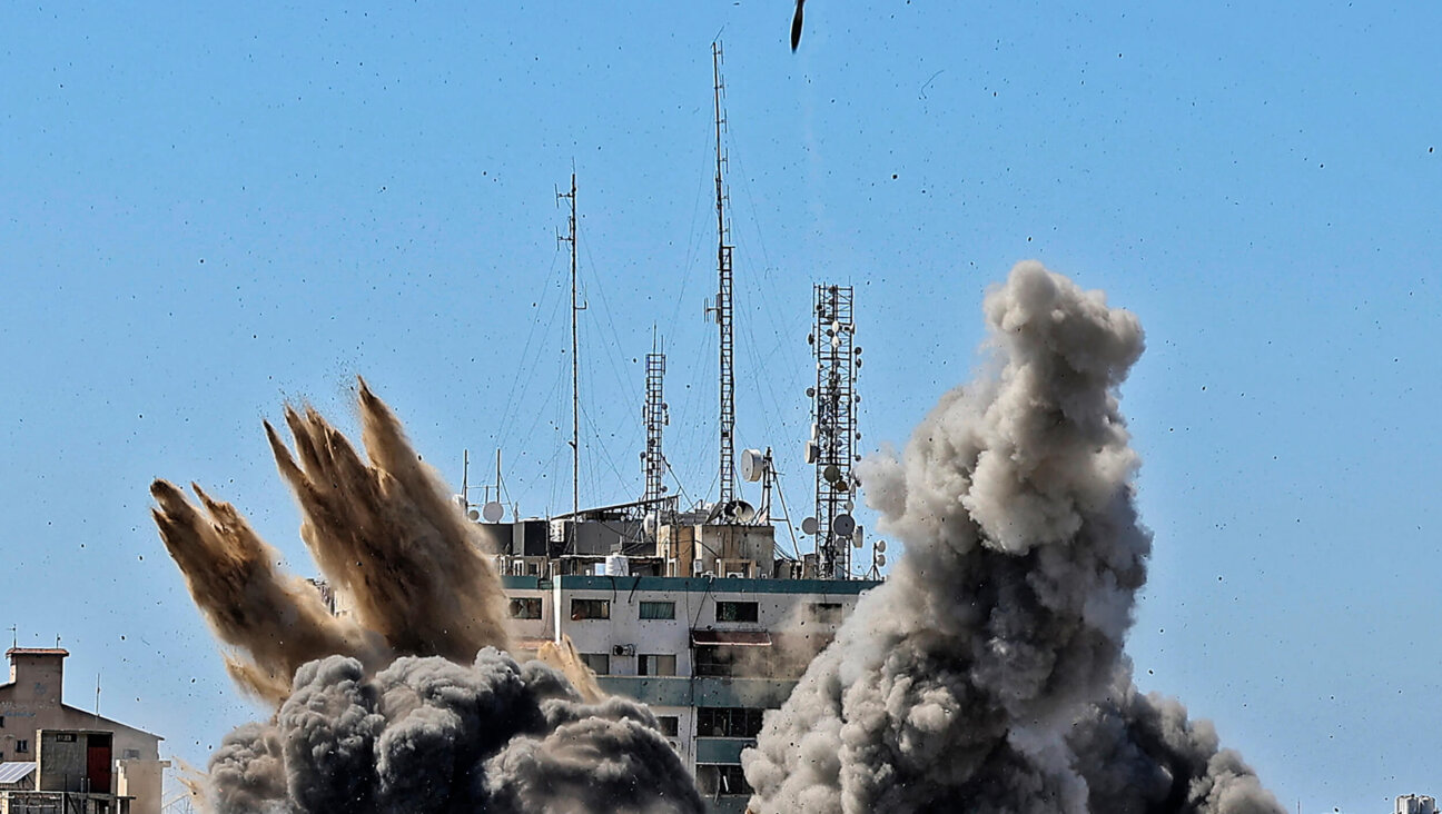 Smoke billows amid an Israeli airstrike on the Jala Tower, which housed Associated Press offices in Gaza, in 2021.