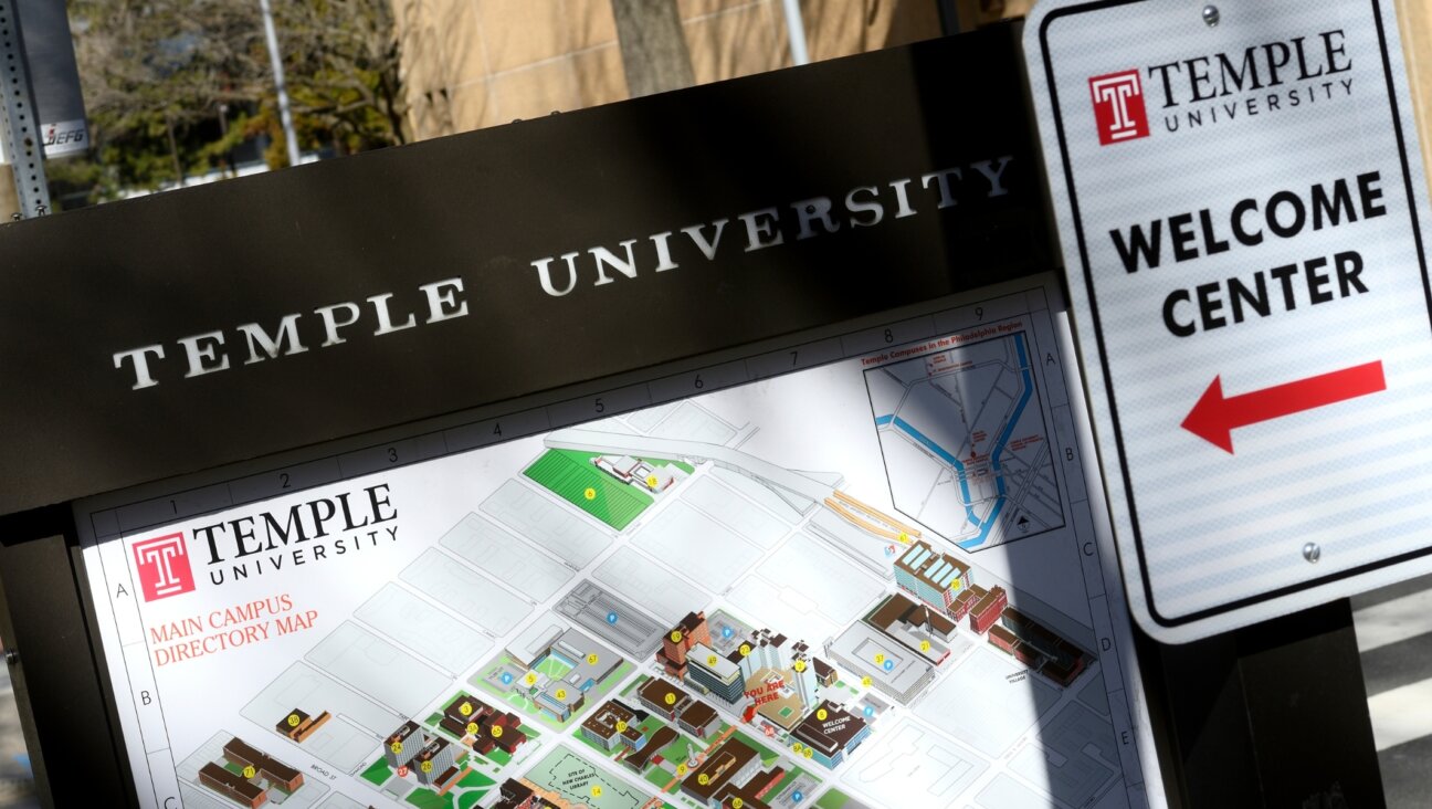 A sign for Temple University's welcome center. 