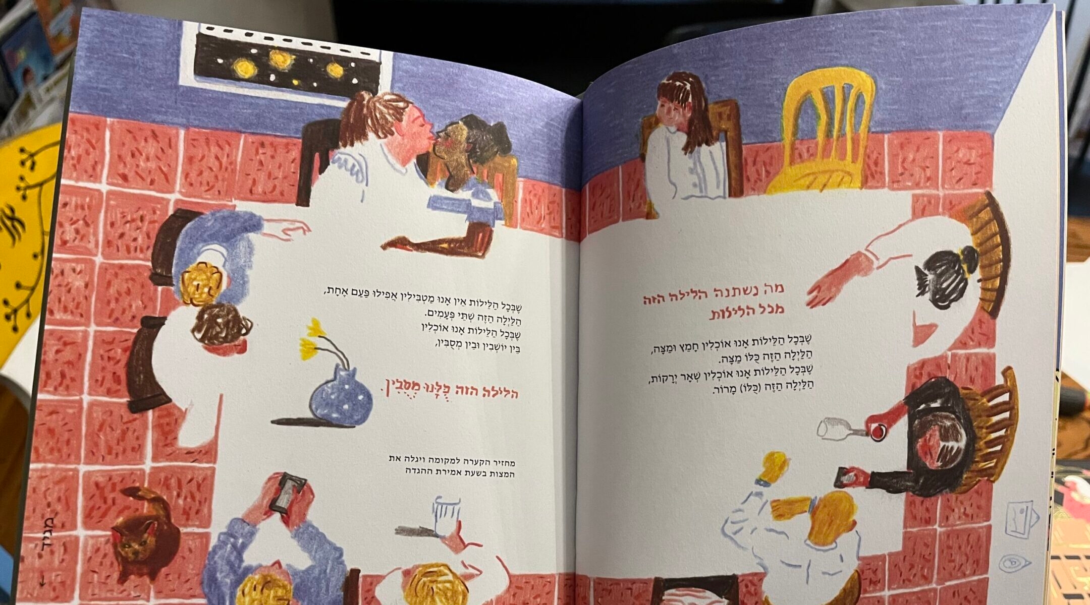 The Asufa haggadah for 2025 includes multiple images showing yellow chairs at seder tables, symbolizing the Israeli hostages who remain in Gaza. (Philissa Cramer)