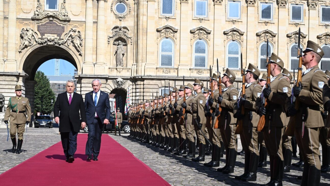 Hungary’s Viktor Orban, left, and Israeli Prime Minister Benjamin Netanyahu walk together in Budapest, April 3, 2025. (GPO)