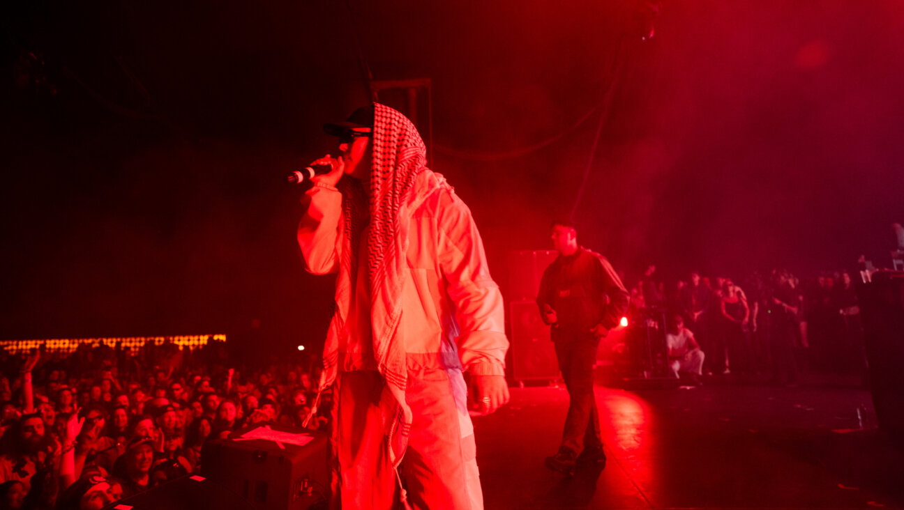 Members of the band Kneecap including Mo Chara and Moglai Bap perform onstage during Day 1 of Coachella on April 18, 2025 in Indio, California. (Scott Dudelson/Getty Images)