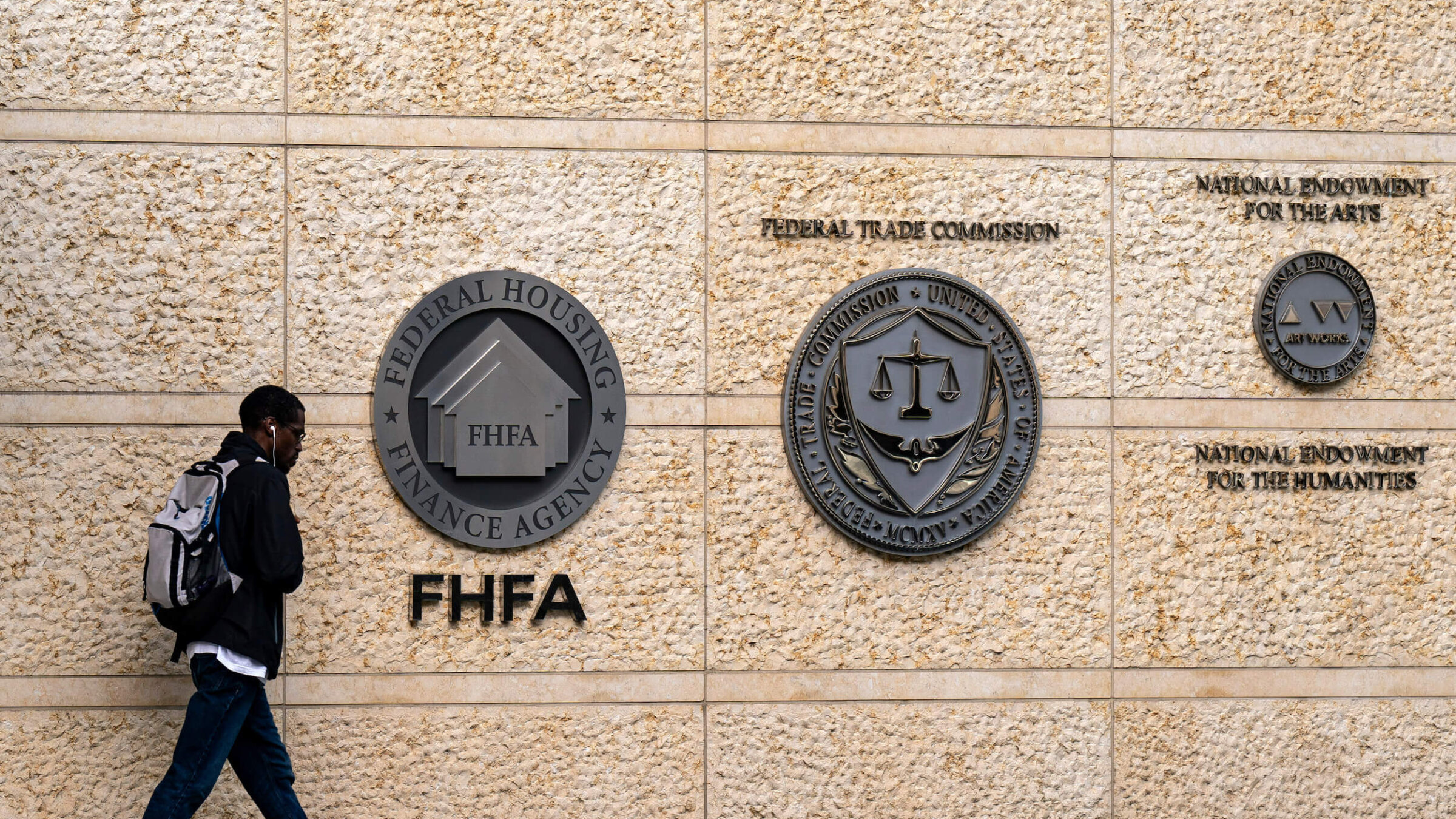 The seals of the Federal Housing Finance Association (FHFA), the Federal Trade Commission (FTC), and the National Endowment for the Arts and National Endowment for the Humanities at the organizations' headquarters in Washington, D.C., on May 20, 2024.