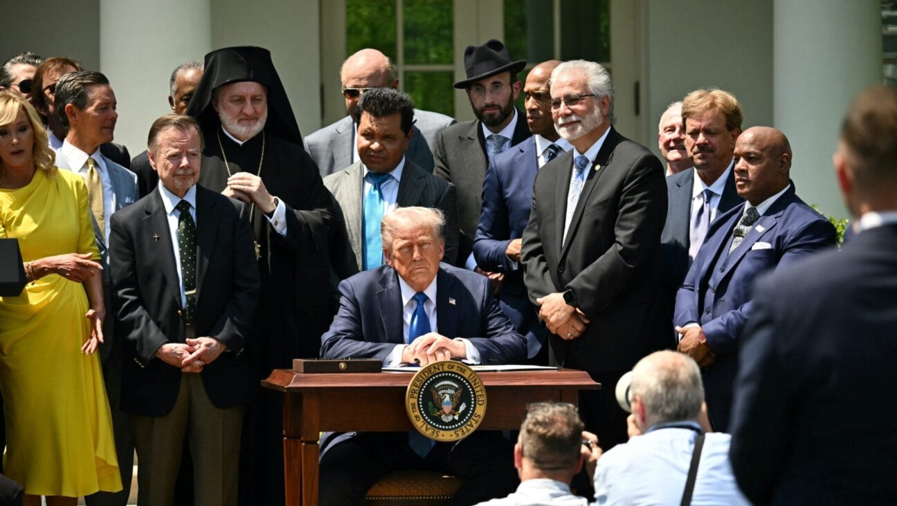 President Donald Trump and faith leaders listen to a song before he signs an executive order on the “Establishment of the Religious Liberty Commission” during a National Day of Prayer event in the Rose Garden of the White House in Washington, D.C., on May 1, 2025. (Mandel Ngan / AFP via Getty Images)